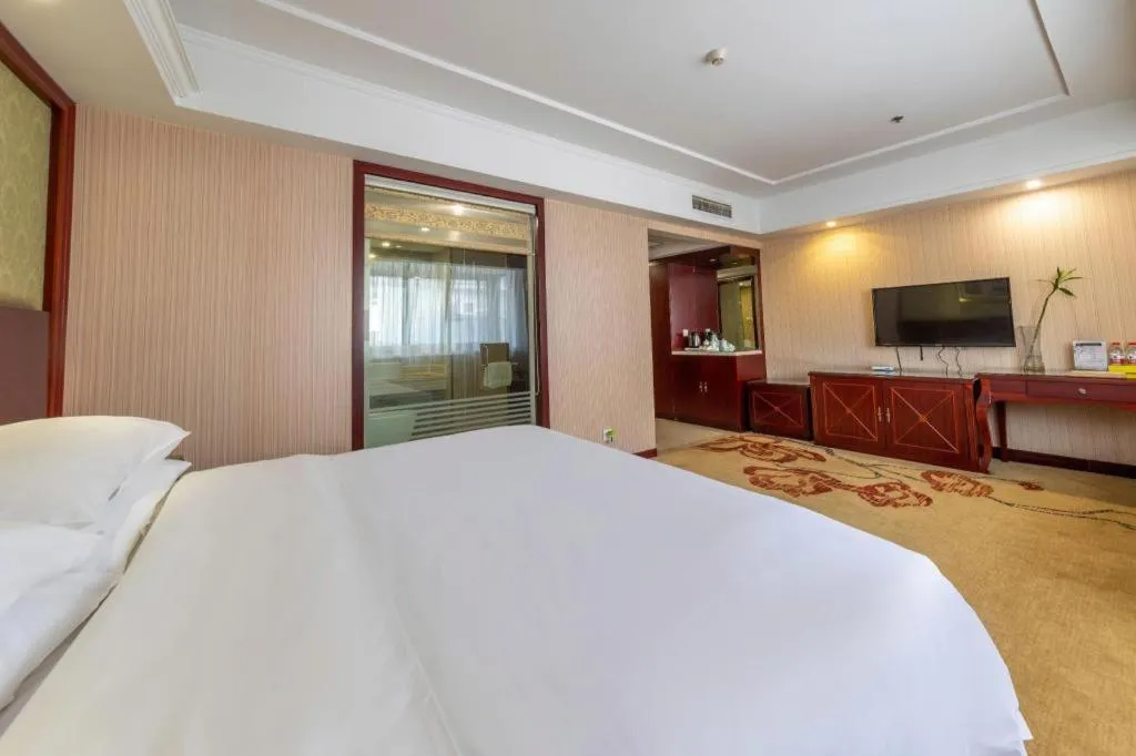 Bed in Vienna Hotel Yangzhou Outlets Plaza He Garden