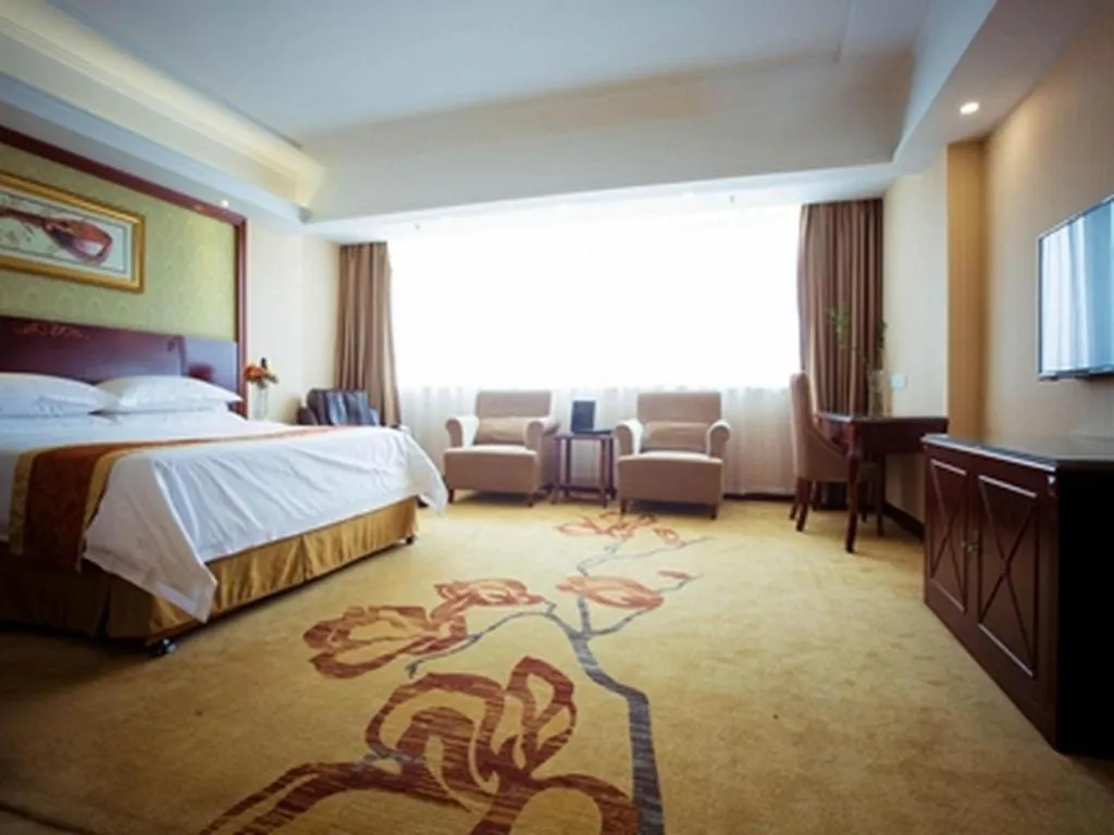 Bed in Vienna Hotel Yangzhou Outlets Plaza He Garden