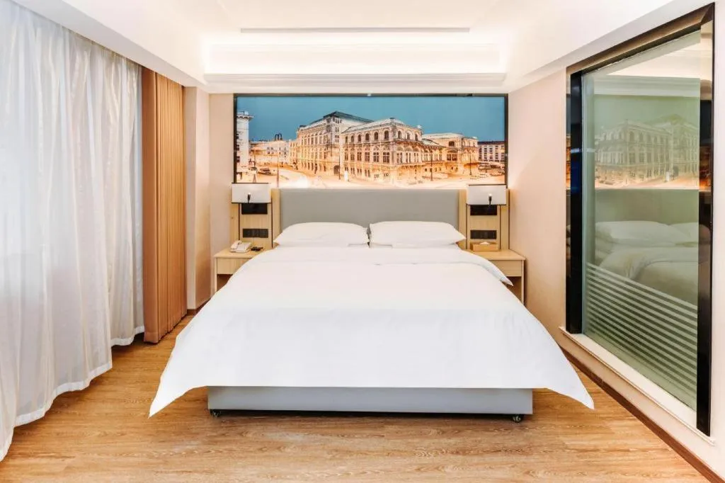 Bed in Vienna Hotel Yangzhou Outlets Plaza He Garden