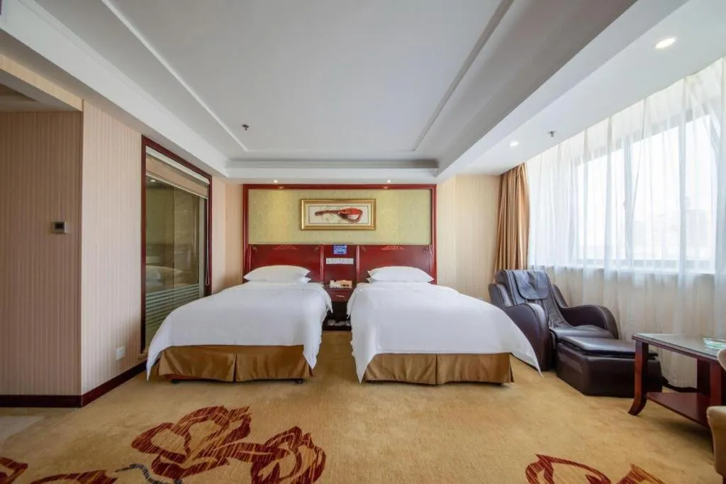 Bed in Vienna Hotel Yangzhou Outlets Plaza He Garden