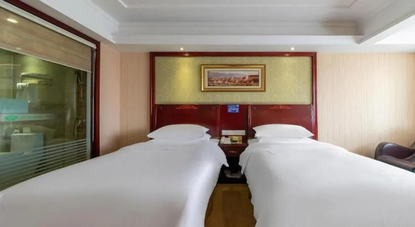 Bed in Vienna Hotel Yangzhou Outlets Plaza He Garden