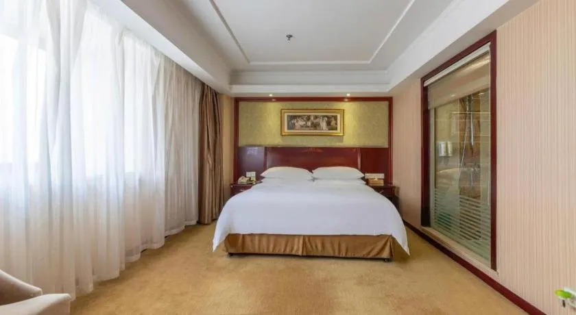 Bed in Vienna Hotel Yangzhou Outlets Plaza He Garden