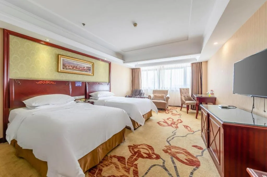 Bed in Vienna Hotel Yangzhou Outlets Plaza He Garden