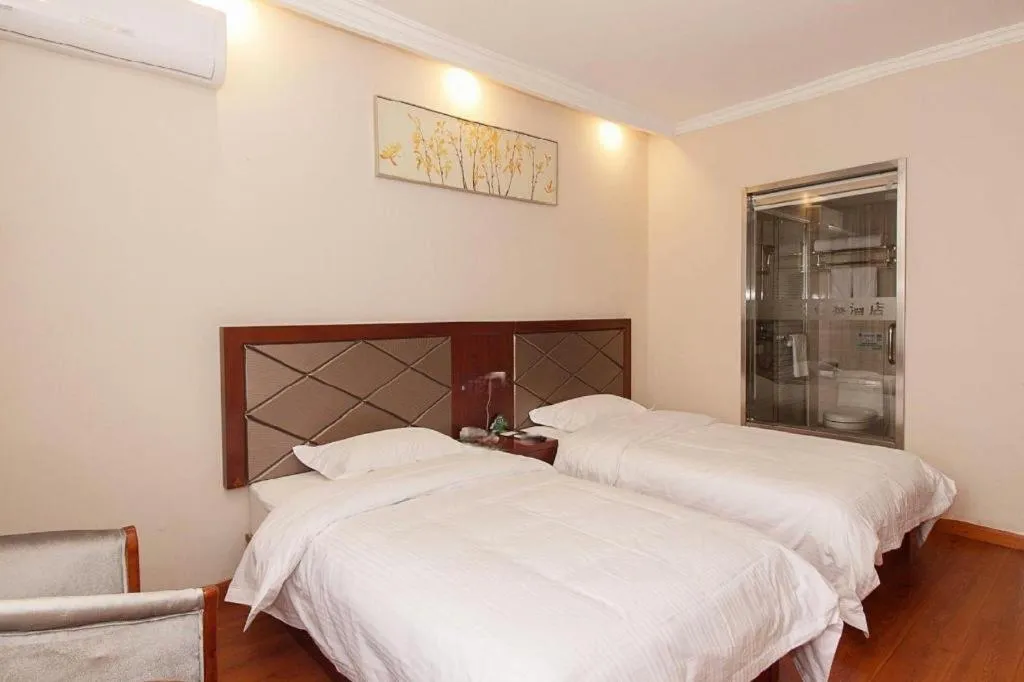 Bed in GreenTree Inn Wuxi Donggang Town Donghutang Shell Hotel