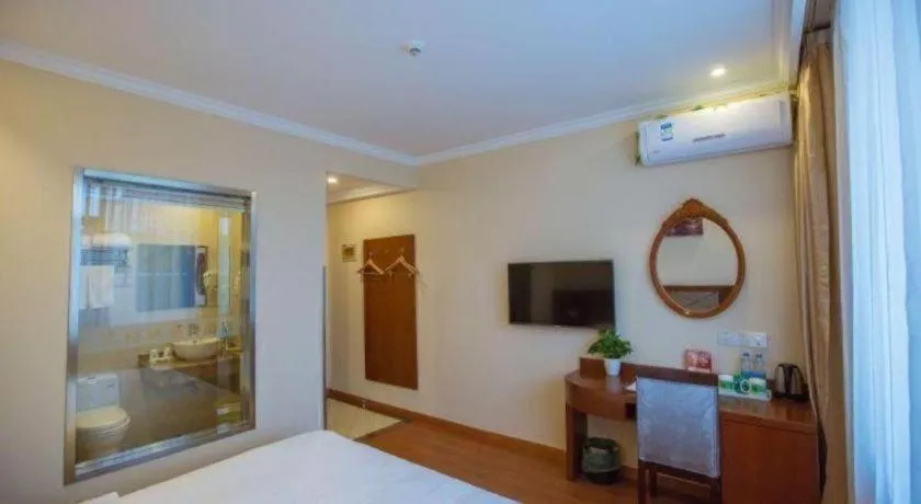 Bed in GreenTree Inn Wuxi Donggang Town Donghutang Shell Hotel