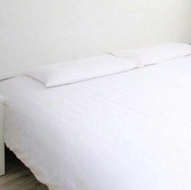 Bed in GreenTree Inn Wuxi Donggang Town Donghutang Shell Hotel