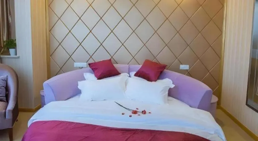 Bed in GreenTree Inn Wuxi Donggang Town Donghutang Shell Hotel