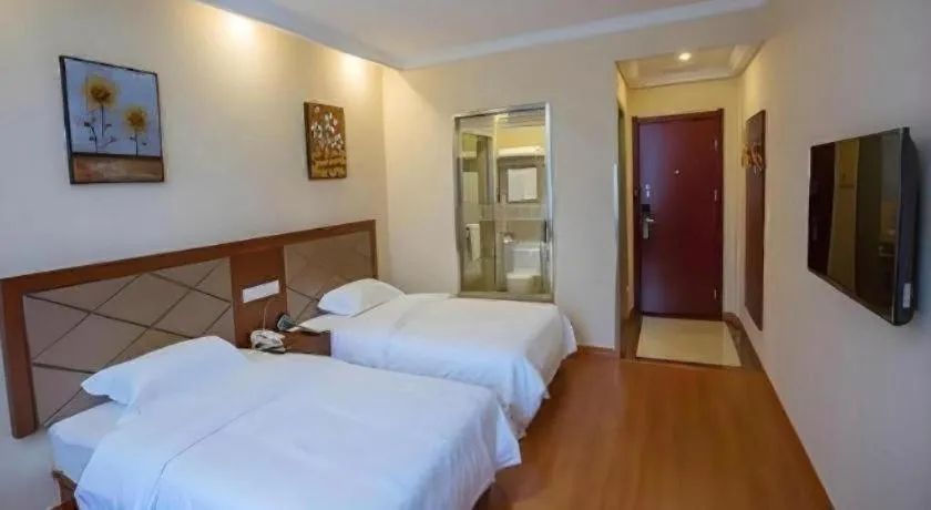 Bed in GreenTree Inn Wuxi Donggang Town Donghutang Shell Hotel
