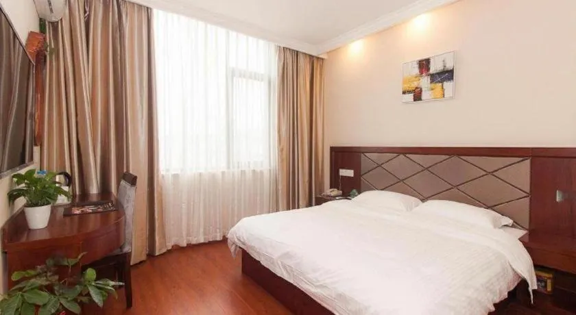 Bed in GreenTree Inn Wuxi Donggang Town Donghutang Shell Hotel