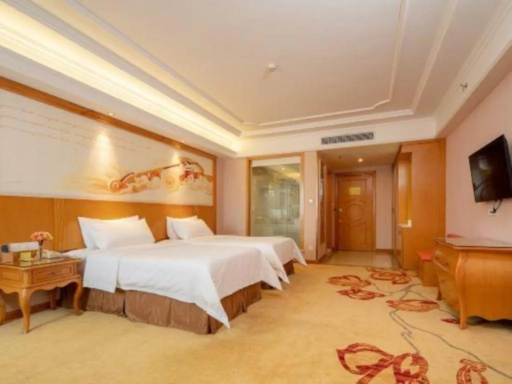 Bed in Vienna International Hotel Guangzhou Jichang Road Huangshi