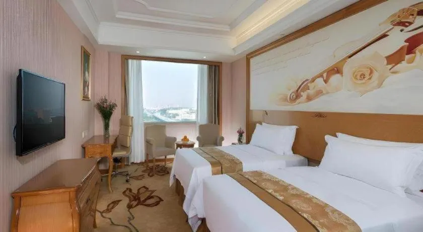 Bed in Vienna International Hotel Guangzhou Jichang Road Huangshi
