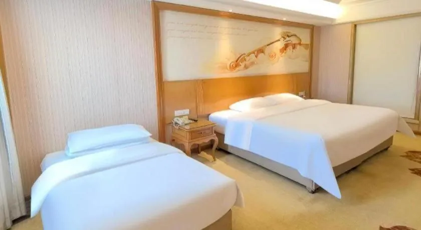 Bed in Vienna International Hotel Guangzhou Jichang Road Huangshi