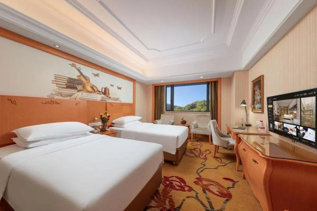 Bed in Vienna International Hotel Guangzhou Jichang Road Huangshi