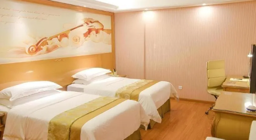 Bed in Vienna International Hotel Guangzhou Jichang Road Huangshi