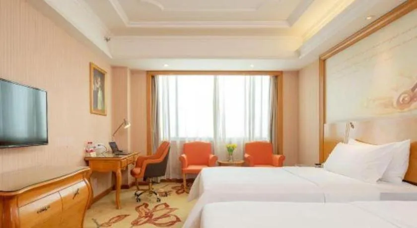 Bed in Vienna International Hotel Guangzhou Jichang Road Huangshi