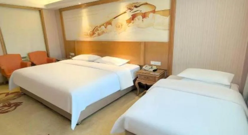Bed in Vienna International Hotel Guangzhou Jichang Road Huangshi
