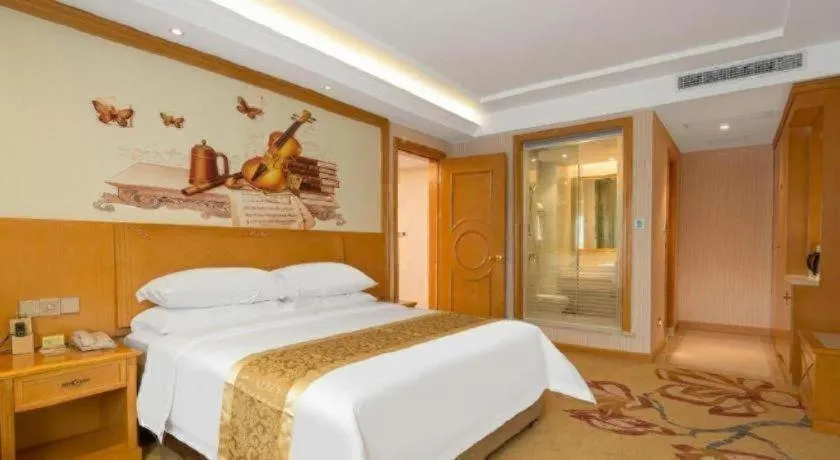 Bed in Vienna International Hotel Guangzhou Jichang Road Huangshi