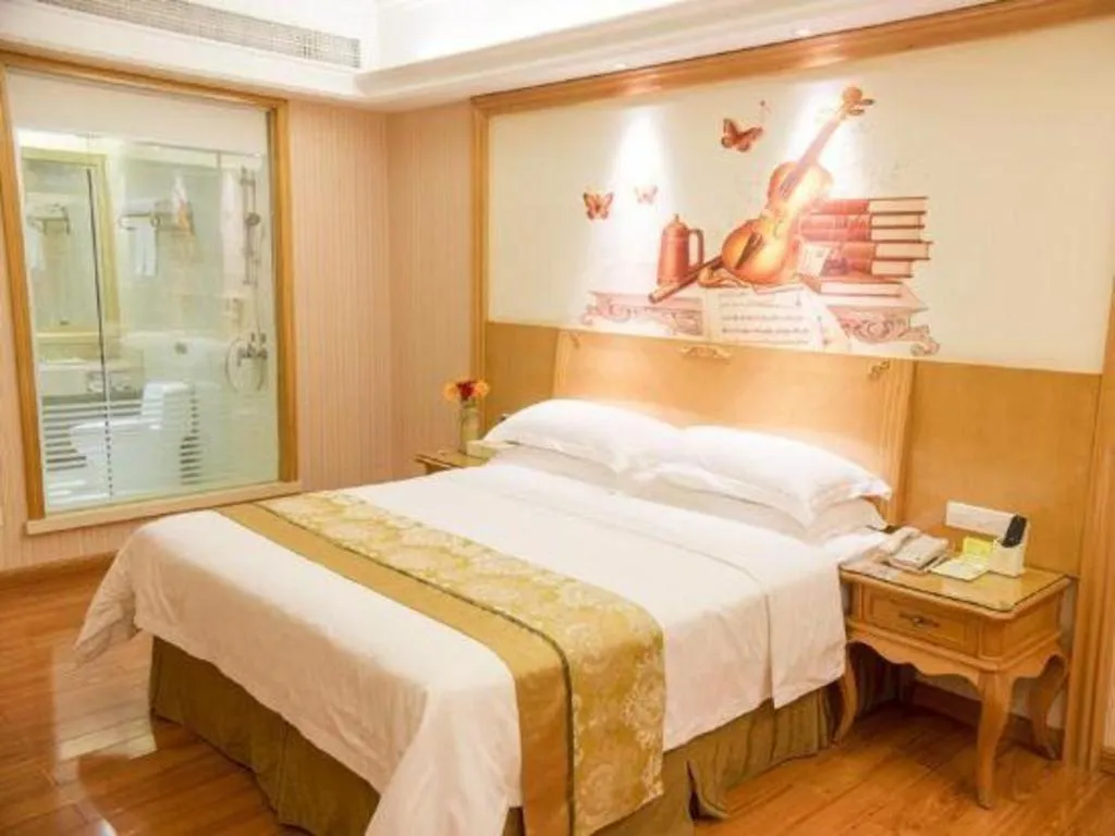 Bed in Vienna International Hotel Guangzhou Jichang Road Huangshi