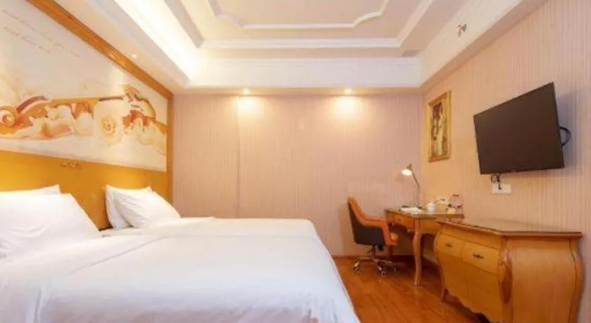 Bed in Vienna International Hotel Guangzhou Jichang Road Huangshi