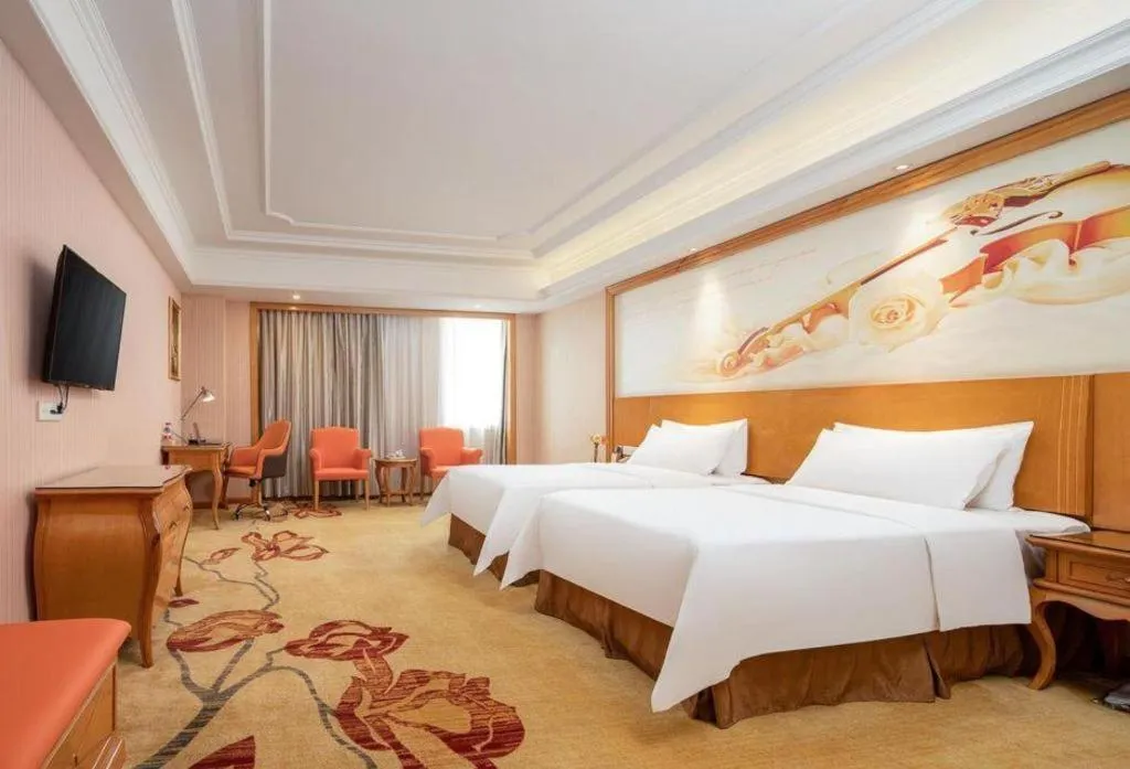 Bed in Vienna International Hotel Guangzhou Jichang Road Huangshi