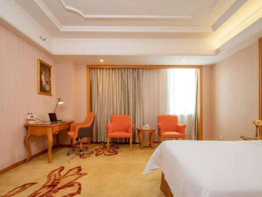 Bed in Vienna International Hotel Guangzhou Jichang Road Huangshi