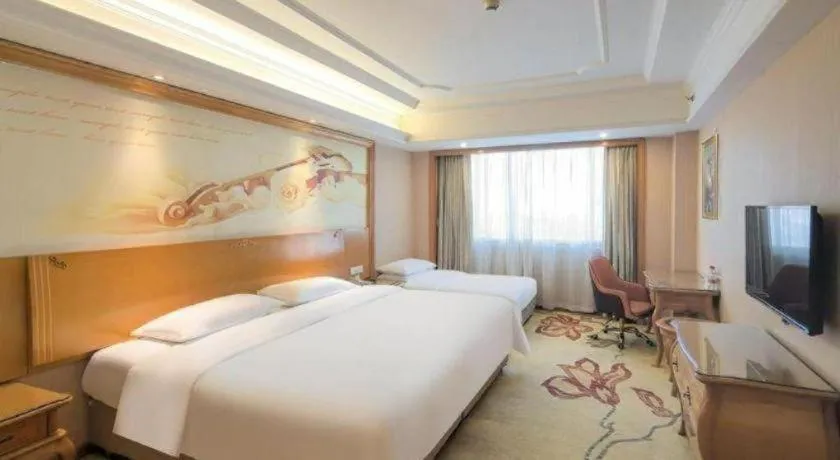 Bed in Vienna International Hotel Guangzhou Jichang Road Huangshi