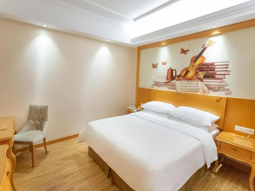Bed in Vienna International Hotel Guangzhou Jichang Road Huangshi