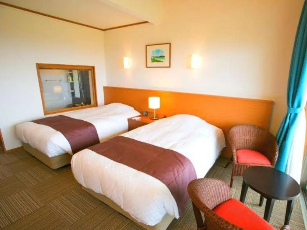 Bed in Sakura Resort Hotel Ishigaki