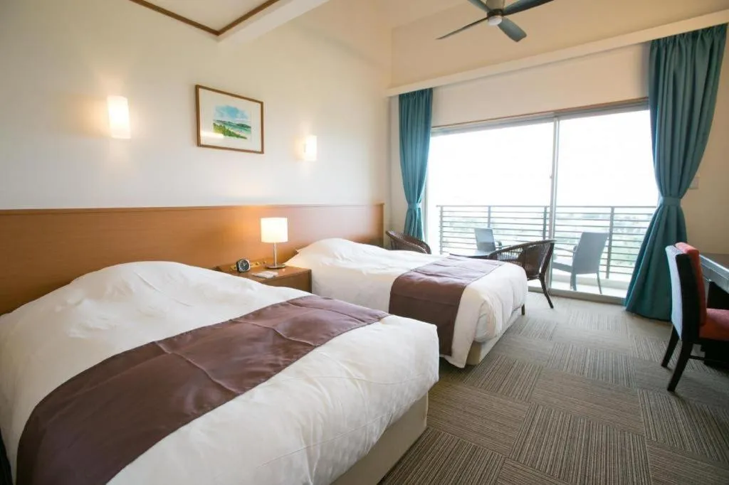 Bed in Sakura Resort Hotel Ishigaki