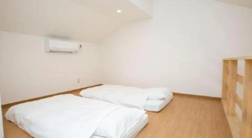 Bed in Sakura Resort Hotel Ishigaki