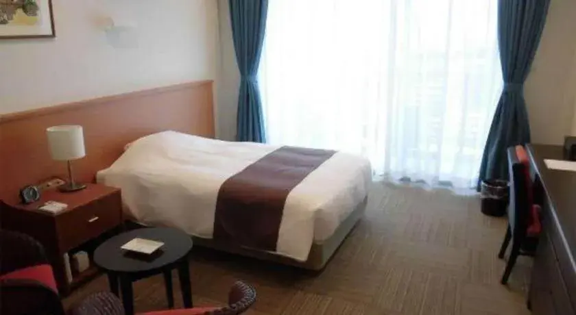 Bed in Sakura Resort Hotel Ishigaki Bed in Sakura Resort Hotel Ishigaki