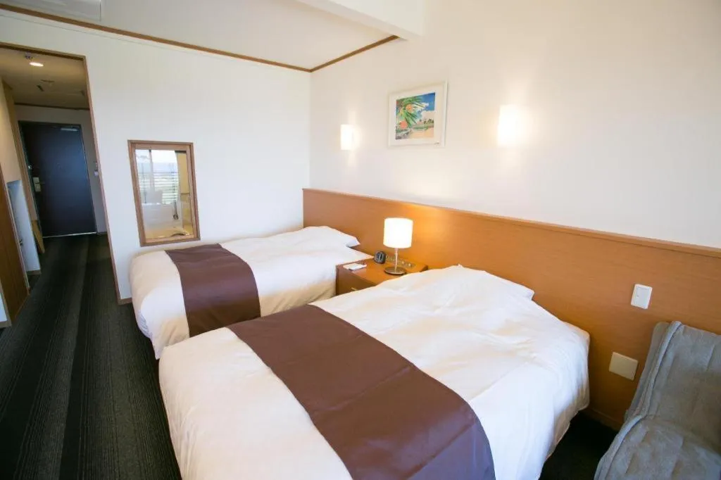 Bed in Sakura Resort Hotel Ishigaki