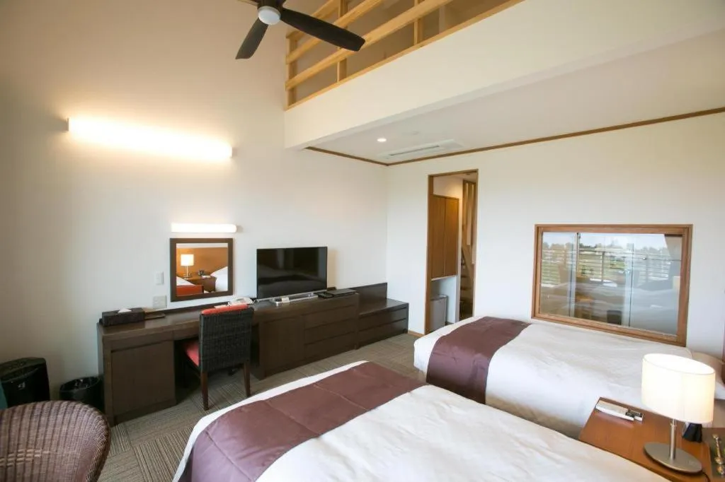 Bed in Sakura Resort Hotel Ishigaki