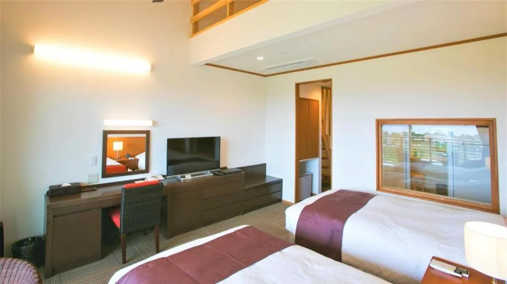 Bed in Sakura Resort Hotel Ishigaki