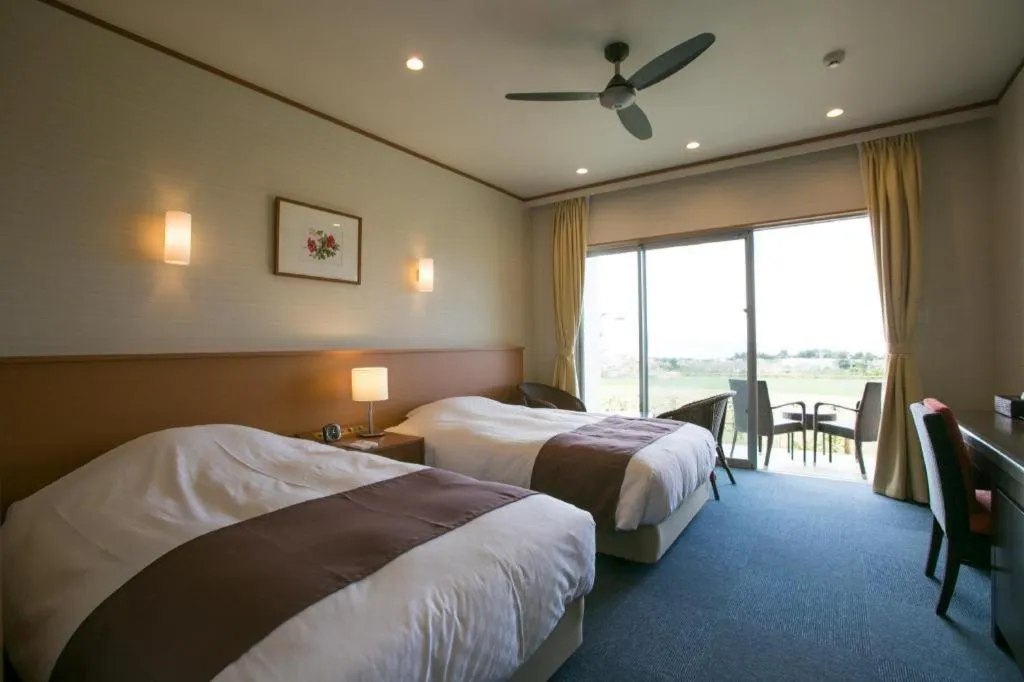 Bed in Sakura Resort Hotel Ishigaki