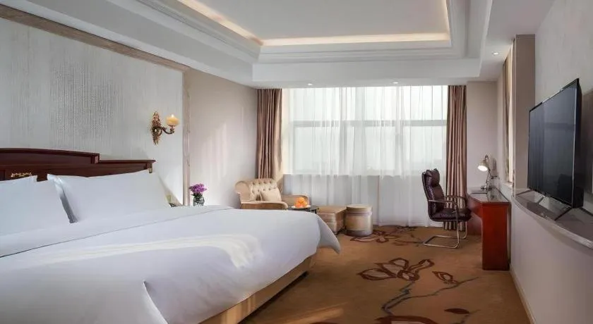 Bed in Vienna International Hotel Wuxi Taihu Expo Center