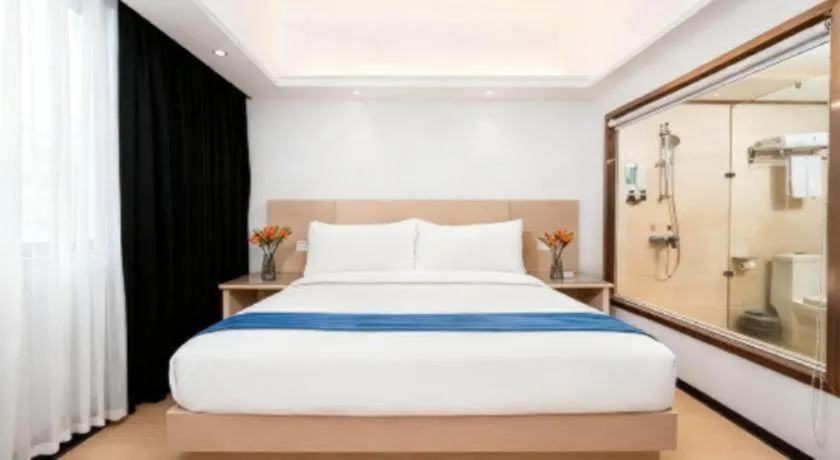 Bed in Vienna Hotel Shenzhen Pinghu Shuangyong Street Metro Station