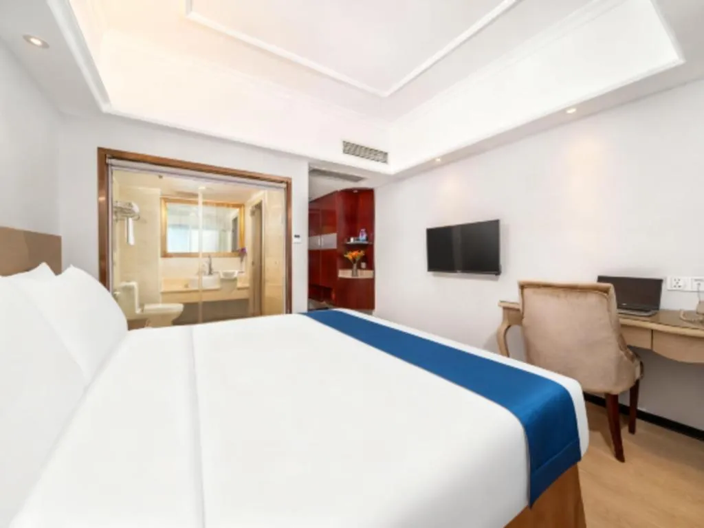 Bed in Vienna Hotel Shenzhen Pinghu Shuangyong Street Metro Station