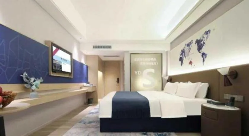 Bed in Vienna Hotel Shenzhen Pinghu Shuangyong Street Metro Station