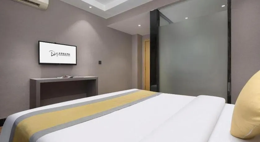 Bed in Vienna Hotel Shenzhen Pinghu Shuangyong Street Metro Station