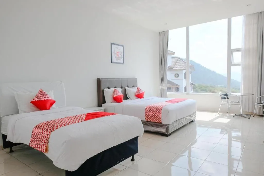 Bed in OYO 1194 Villa Bukit Panderman Residence