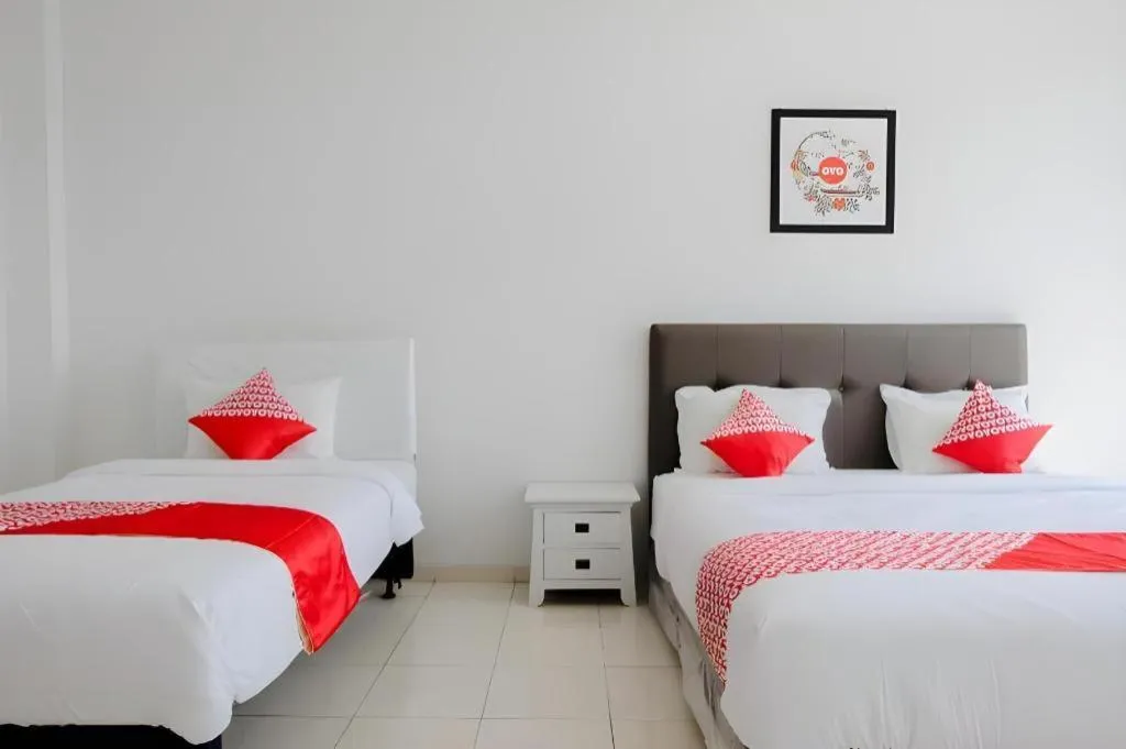 Bed in OYO 1194 Villa Bukit Panderman Residence