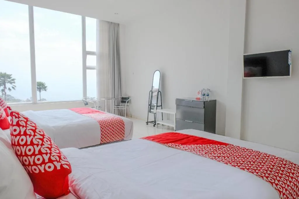 Bed in OYO 1194 Villa Bukit Panderman Residence