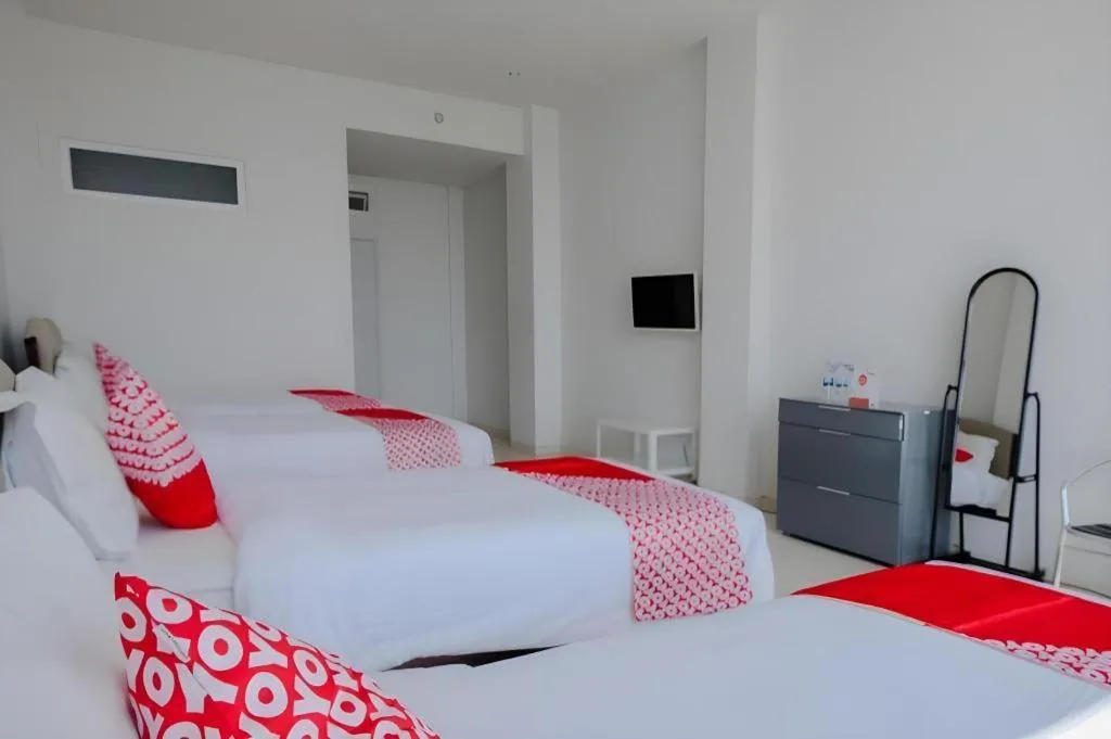 Bed in OYO 1194 Villa Bukit Panderman Residence