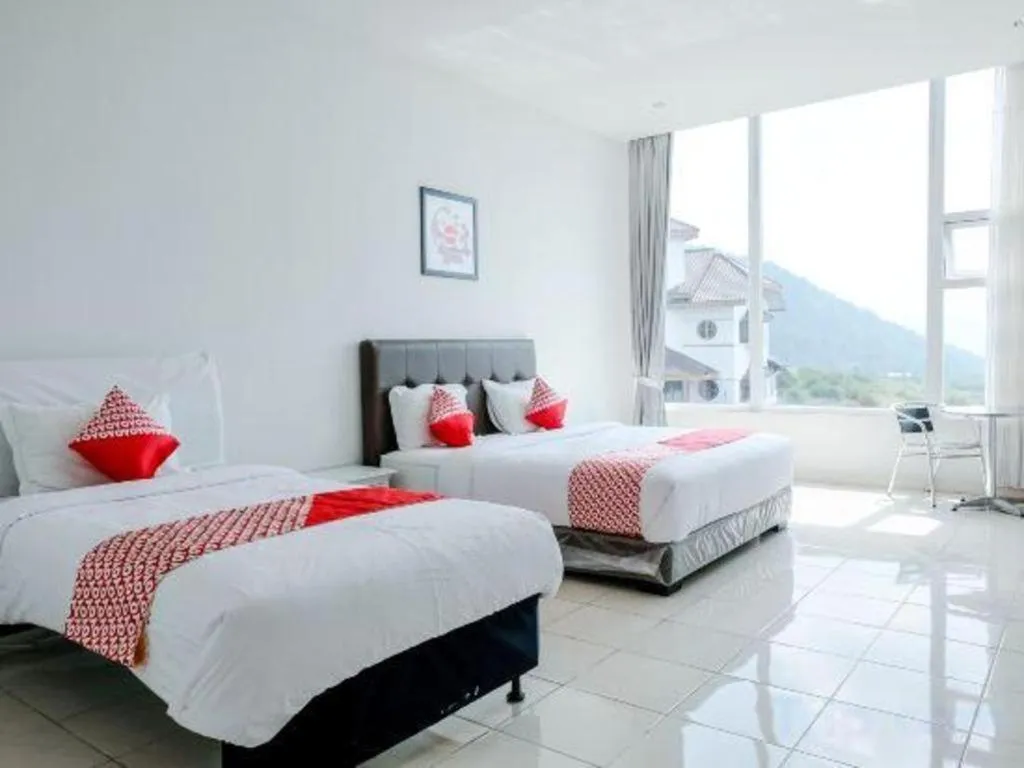 Bed in OYO 1194 Villa Bukit Panderman Residence