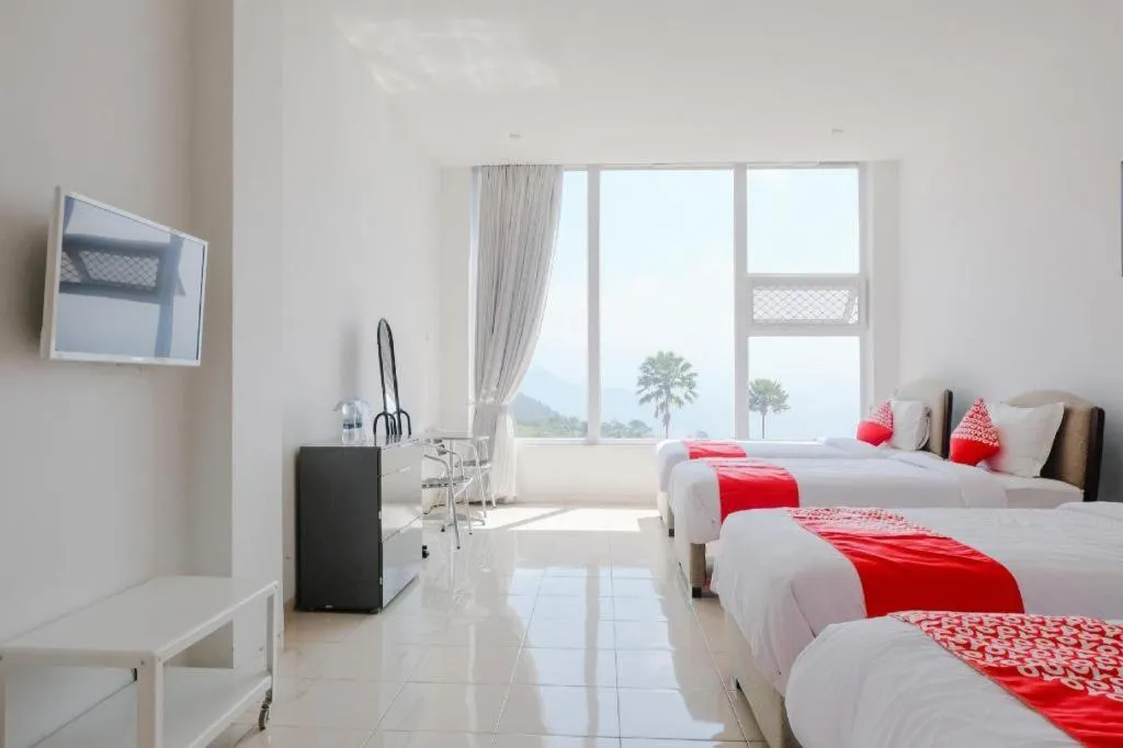 Bed in OYO 1194 Villa Bukit Panderman Residence