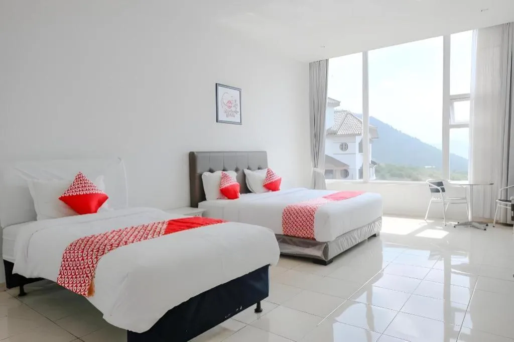 Bed in OYO 1194 Villa Bukit Panderman Residence