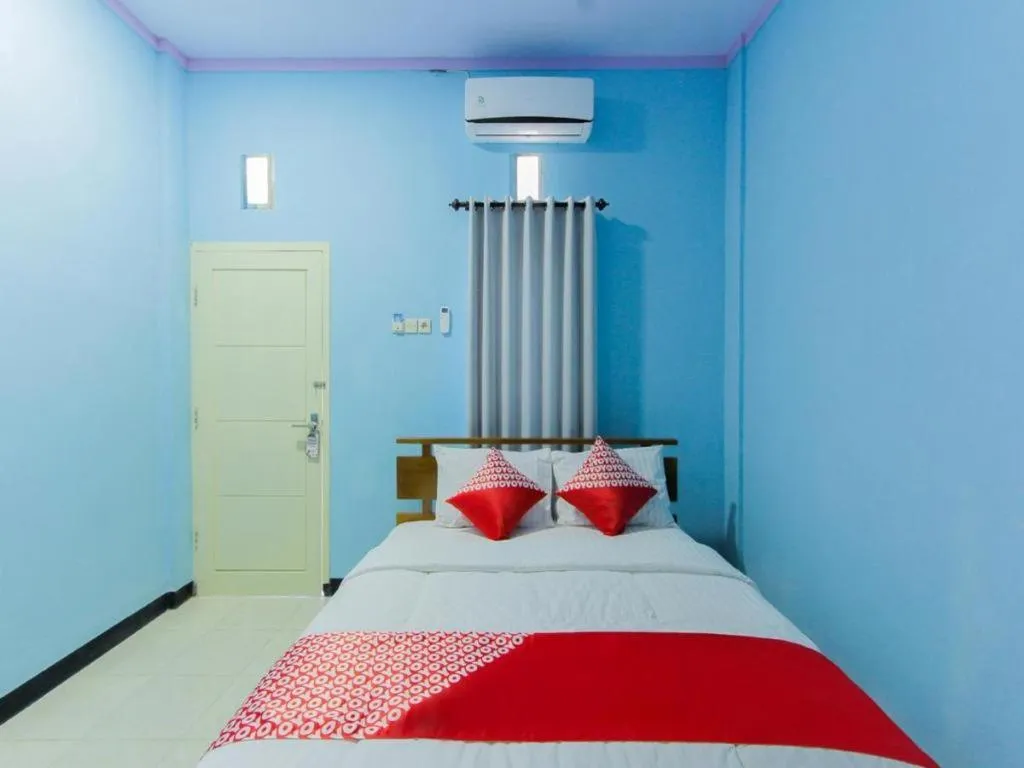 Bed in Hotel O Asipra House