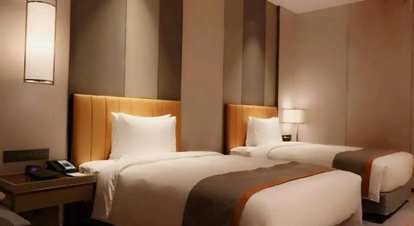 Bed in Hui Feng Wan Yun Hotel Hefei