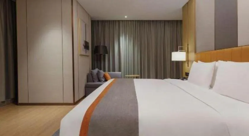 Bed in Hui Feng Wan Yun Hotel Hefei